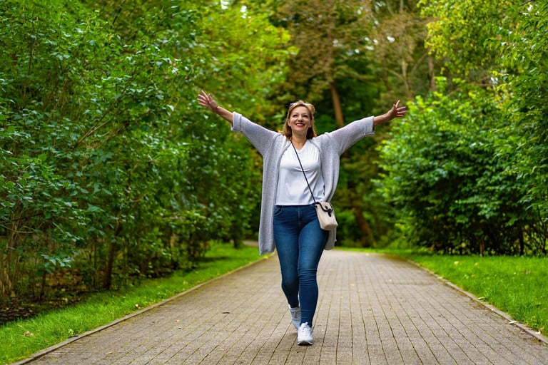 Beautiful mature women walking joyfully in city park, embracing life with happiness and purpose