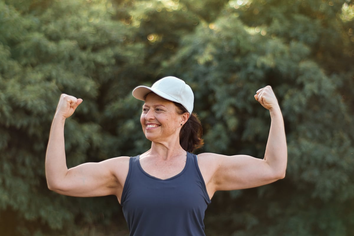 Confident mature woman standing tall, radiating presence and self-assurance