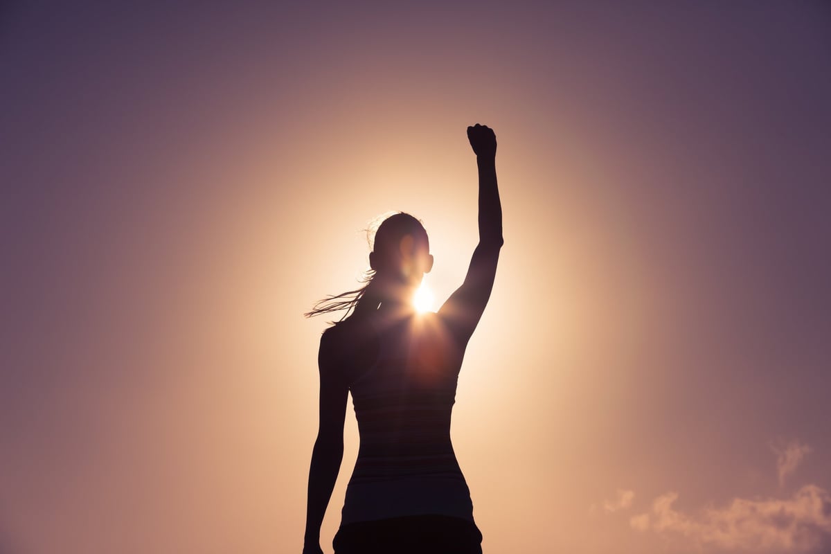 Strong confident woman standing tall, radiating empowerment and self-assurance